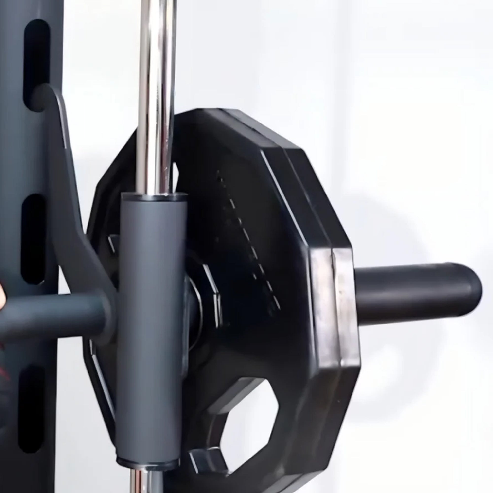 Close-up of a gym barbell with weight plates on a white background