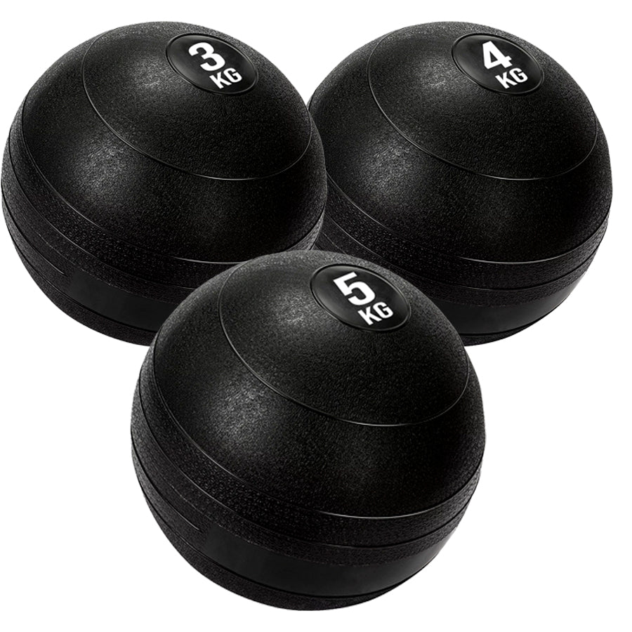 3 black heavy duty slam balls with a textured surface and the white background