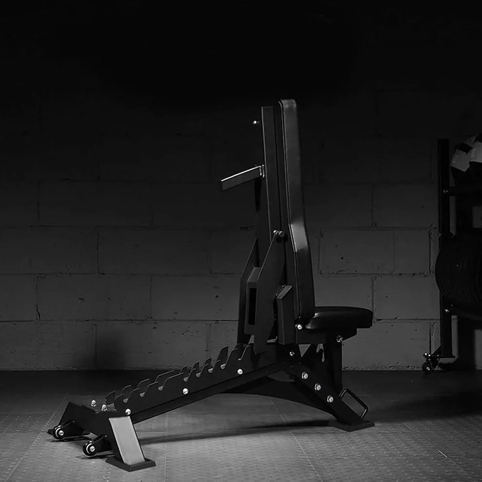 Black weight bench in a gym setting with a dark background