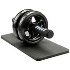 Black ab roller on a black mat on a white background