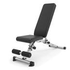 A black and silver adjustable weight bench with six backrest positions, including incline, flat, and decline angles, with integrated dip station and rack.