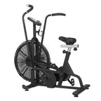 Black air bike exercise machine on a white background