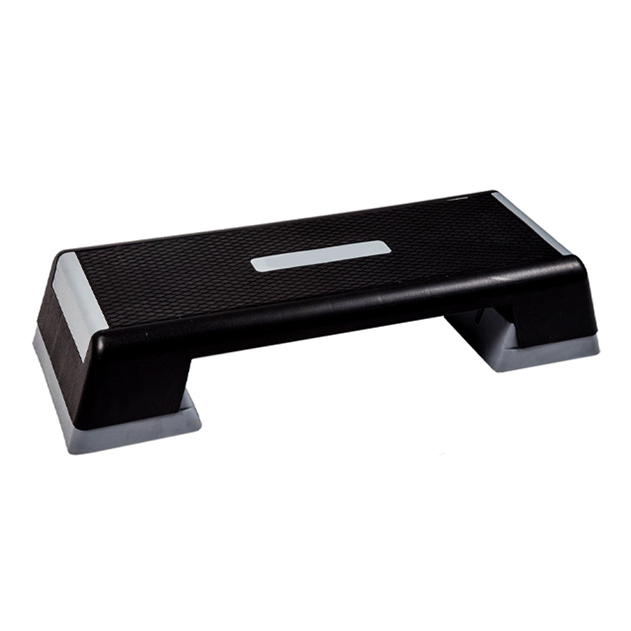 Black step platform with non-slip surface on a white background