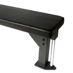 Black flat bench with metal legs on a white background
