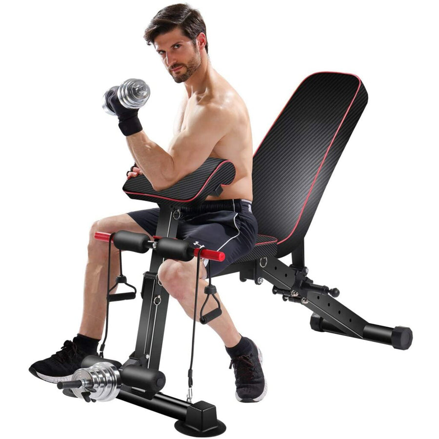 Man exercising with a weight bench and dumbbells on a white background