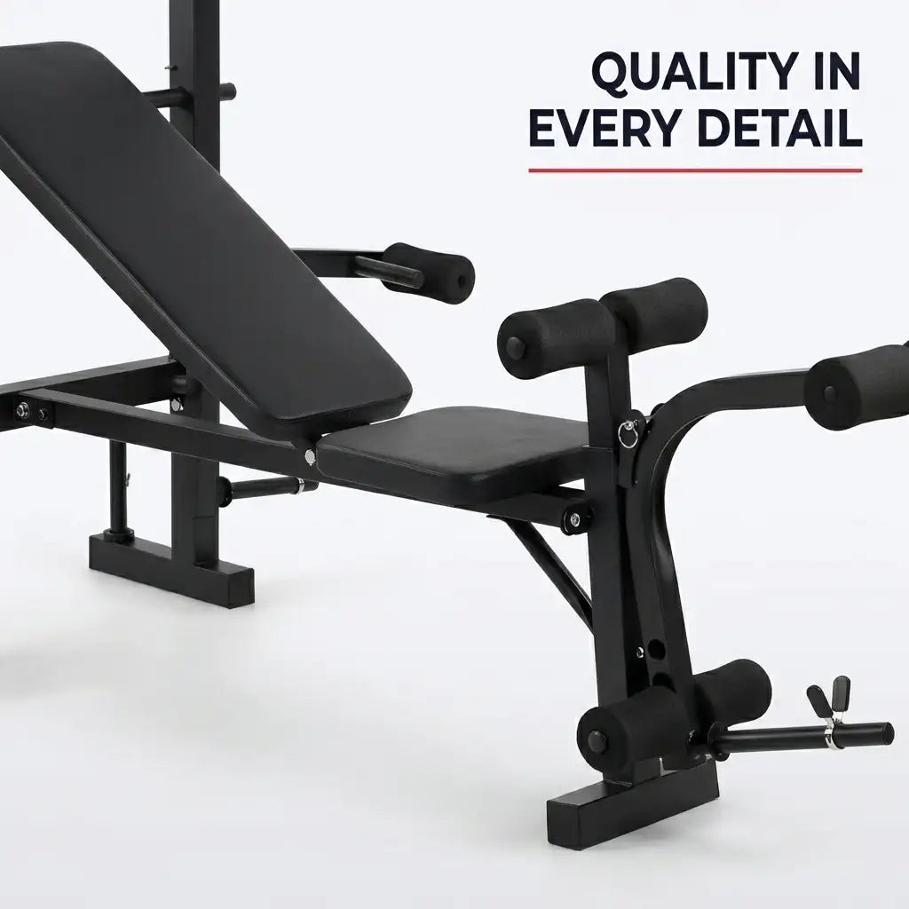 Black adjustable weight bench with leg extension and angled backrest, shown on a clean white studio background with the text 'QUALITY IN EVERY DETAIL' in the top right.