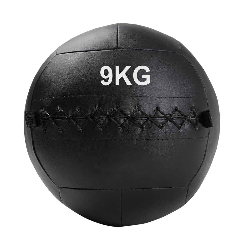 A black, double-stitched, textured wall ball with the weight '9KG' printed on it.
