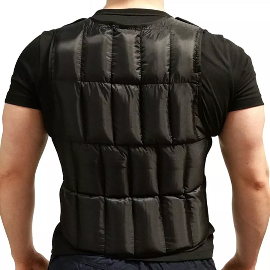 Black puffer vest worn by a person on a plain background