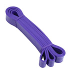 A set of five resistance bands in different colors, including yellow, red, black, purple, and green, displayed with a black carrying pouch.