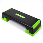 Black and green step platform on a white background