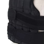 Black weighted vest on a person against a white background