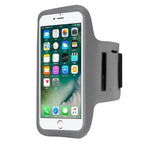 A black sports armband phone holder with an adjustable strap, designed to fit smartphones like the iPhone or Samsung Galaxy. It shows a smartphone with a touchscreen visible and the armband's Velcro closure on the side.