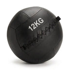 A black 12kg leather medicine ball with white printed text and black diamond-stitched seams, shown on a white background.