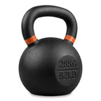 A matte black cast iron kettlebell with a curved handle, featuring orange bands near the top and '28KG / 62LB' embossed on the side, isolated on a white background.