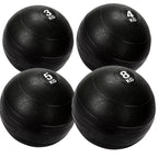 4 black heavy duty slam balls with a textured surface and the white background