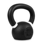 A black cast iron kettlebell with a textured finish, featuring white painted accents on the rim and a circular weight marking embossed with '4KG 9LB' on the front, set against a plain white background.