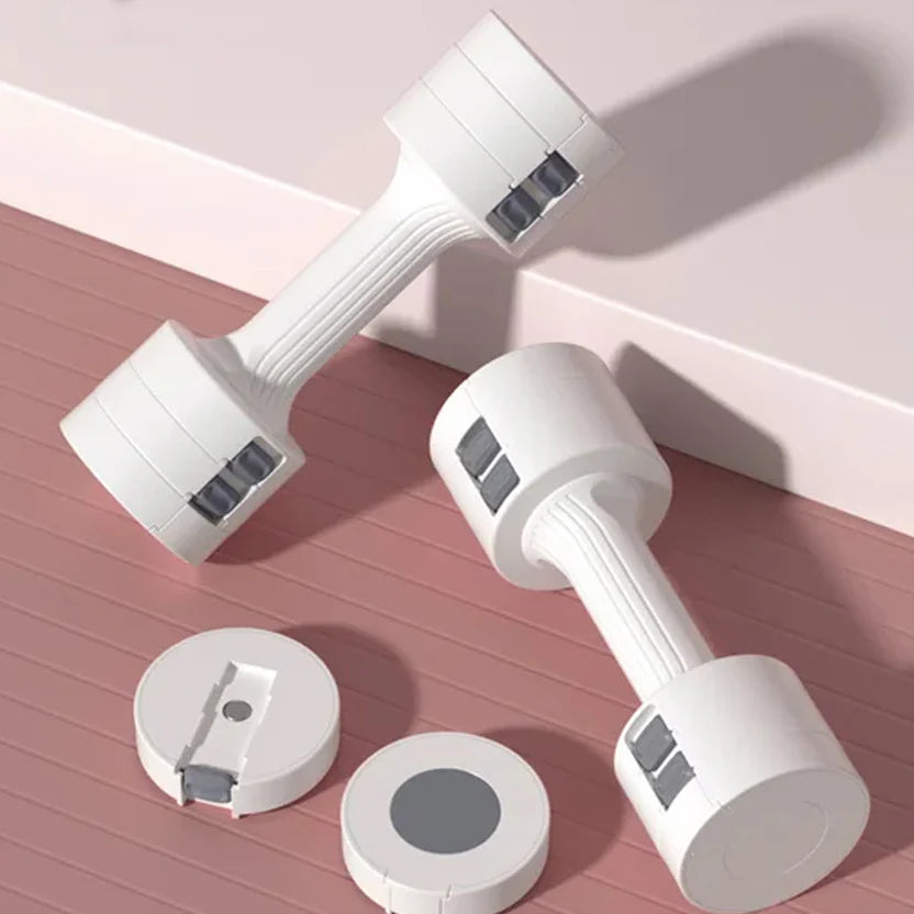 Pair of white dumbbells on a pink surface with a light pink background