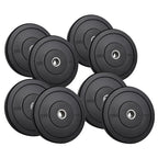 Set of black bumper weight plates with varying weights on a white background