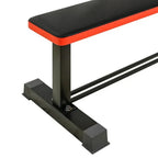 Black weight bench with red edge on a white background