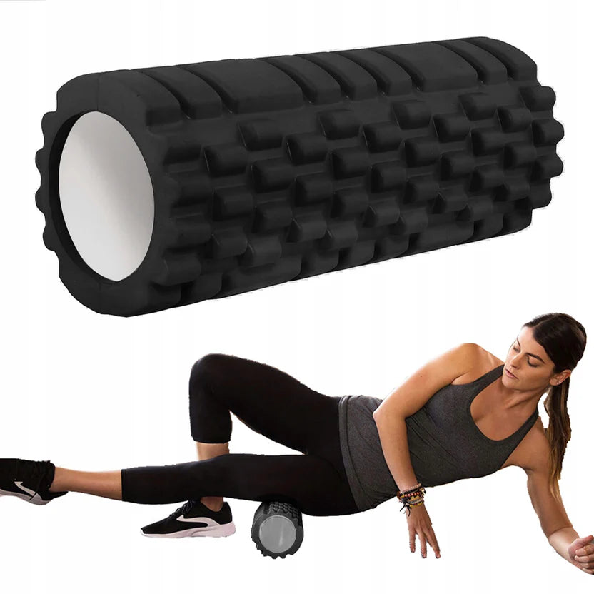 Black foam roller with a person using it for exercise on a white background