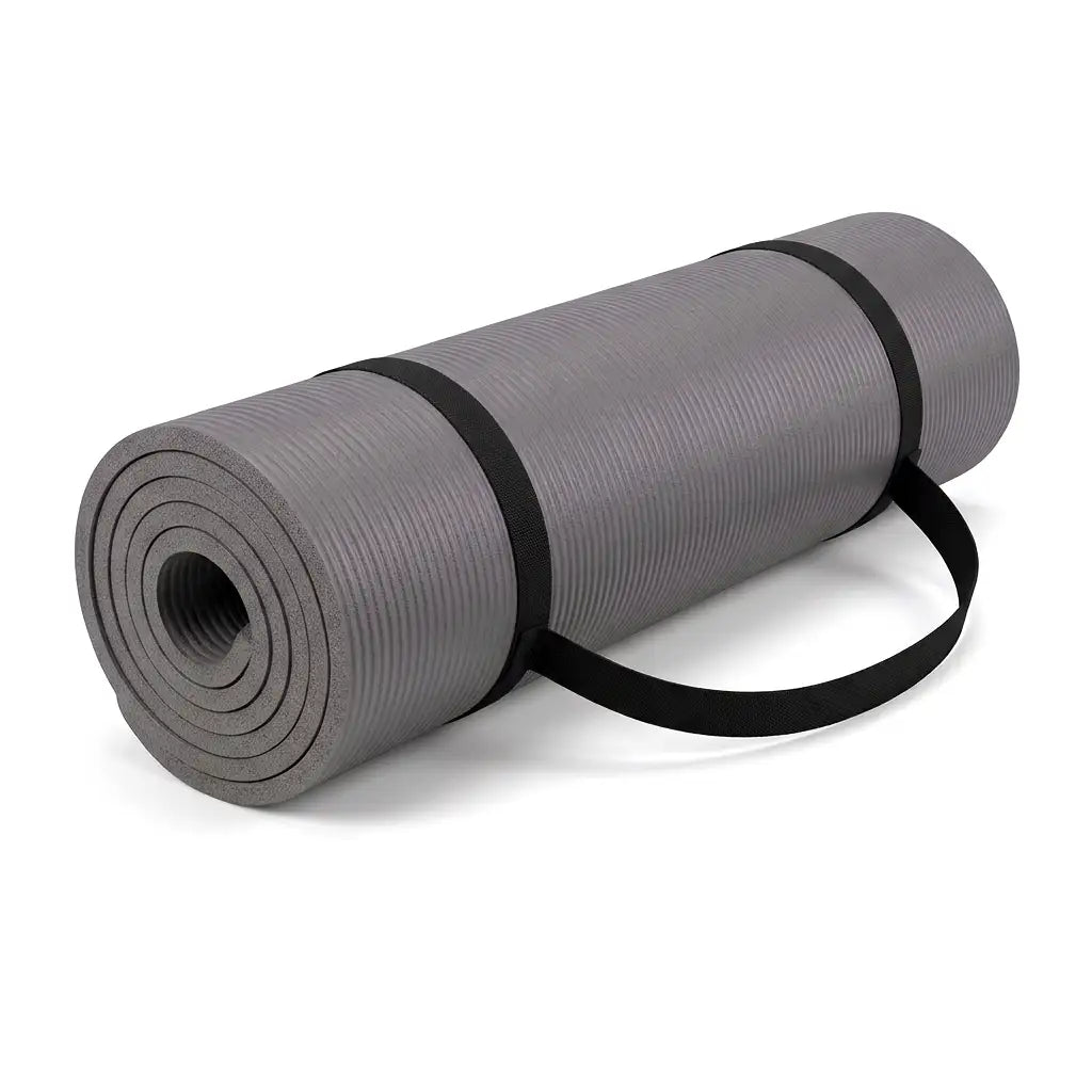 A gray rolled exercise or yoga mat with a black carrying strap, photographed on a clean white background.
