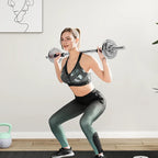 Woman performing squats with a barbell in a home gym setting