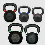 Set of five black kettlebells with labeled weights on a light gray background