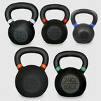 Set of five black kettlebells with labeled weights on a light gray background