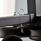 Close-up of a mechanical component with a metallic finish on a blurred background