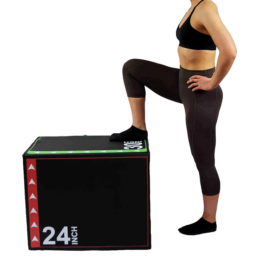 Person in athletic wear standing on a black exercise box with '24 INCH' text.