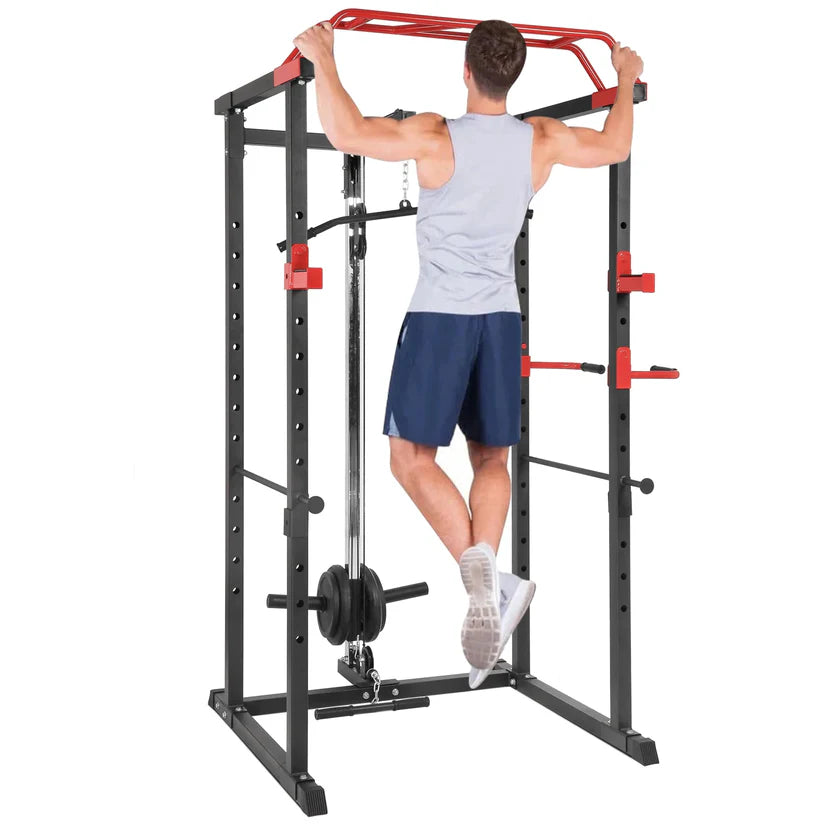 Person using a black and red power rack on a white background