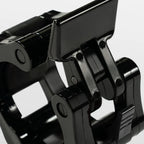 Close-up of a black metal bracket on a white background