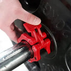 Red tool being used on a car tire valve stem cap.