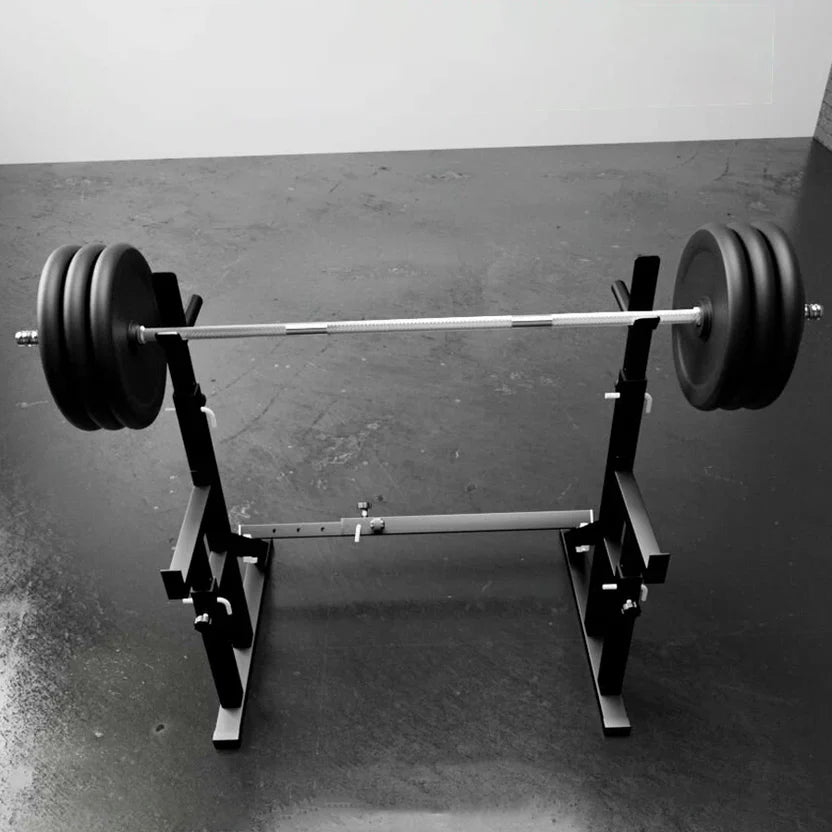 Barbell with weights on a weightlifting platform against a plain background