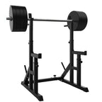 Black weightlifting power rack with barbell on a white background