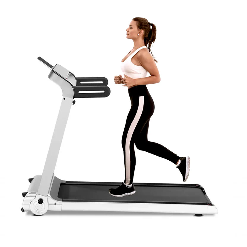 Woman running on a treadmill with a white background