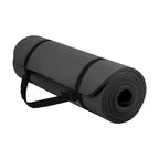 Black yoga mat with a carrying strap on a white background