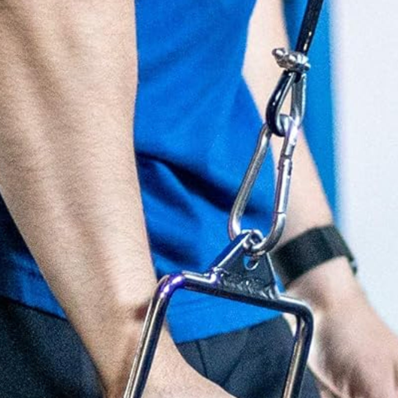 Close-up of a metal clip held by a person wearing a blue shirt.