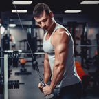 Man exercising with cable machine in a gym setting