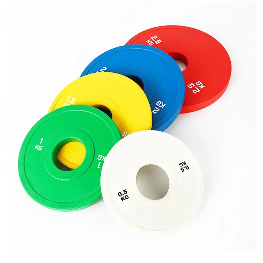 Set of colorful weight plates on a white background